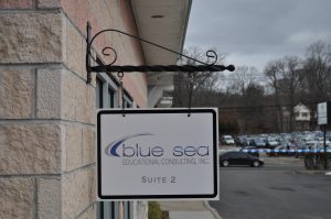 New Orleans Wayfinding Signs outdoor hanging blade sign blue sea building business wayfinding address sign 300x199